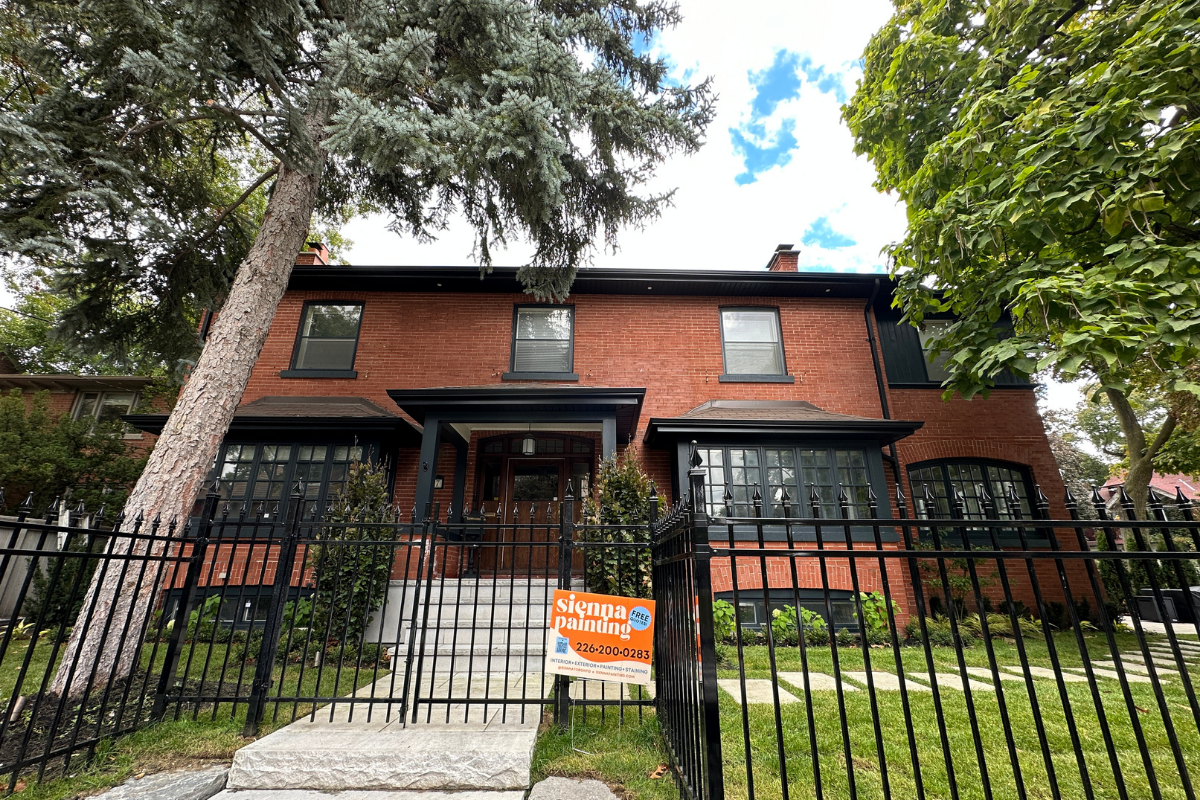 Completed exterior project with Sienna Painting sign